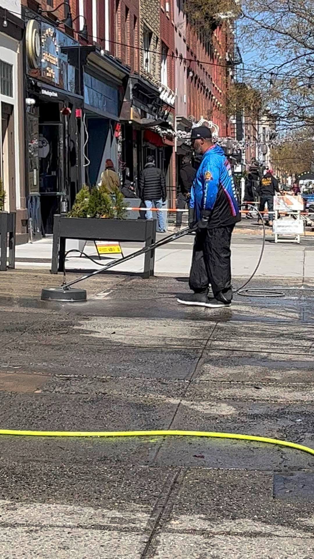 Premier Power Washerz surface cleaning a Washington Street sidewalk in Hoboken